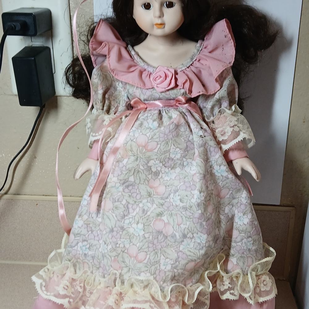 Vintage Elegant Porcelain Doll with Pink Floral Dress